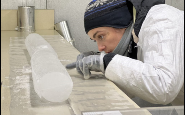 Emilie in the BPCRC cold room, observing the visual stratigraphy of the Huascarán ice core.