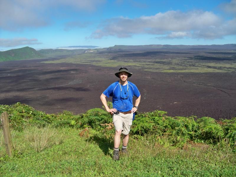 SES Alum Dan Kelley on the rim of the crater at the Sierra Negra Volcano; Isabela Island, Galapagos Islands