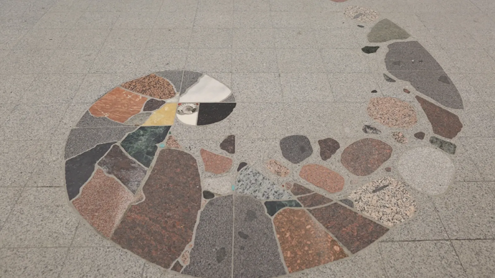 Spiral made of different rocks inlaid on the floor of Mendenhall Laboratory's first floor lobby