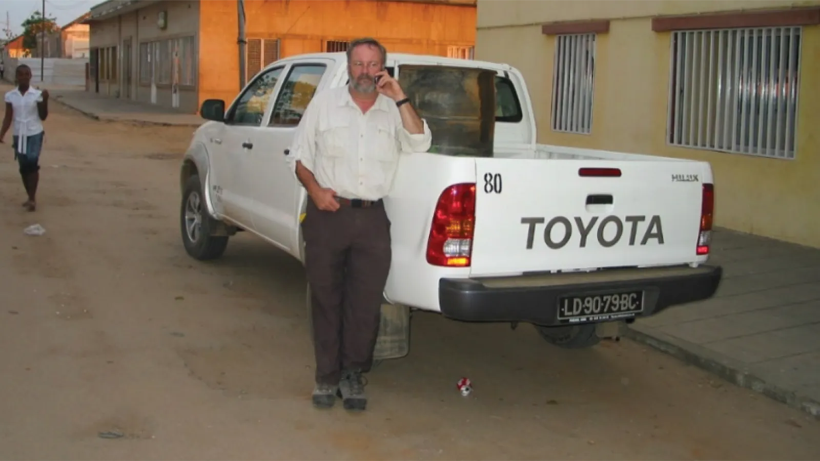 Michael Beathard leaning against a truck in Angola