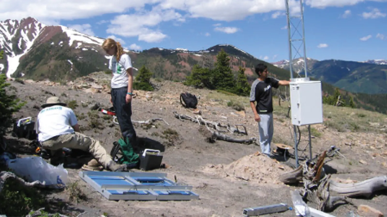 Jeff Fox doing field work with colleagues in the mountains