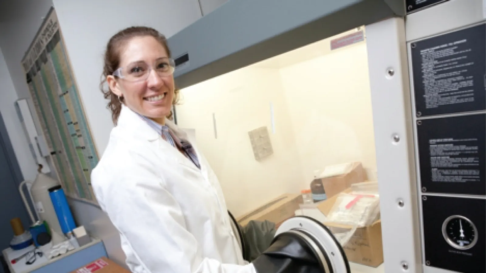 Ale Hakala wearing PPE and working in an anaerobic chamber