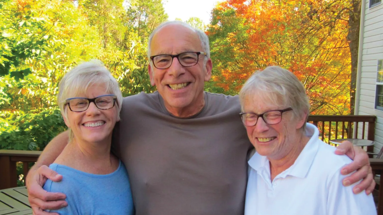 Bruce Hulman smiles and hugs family