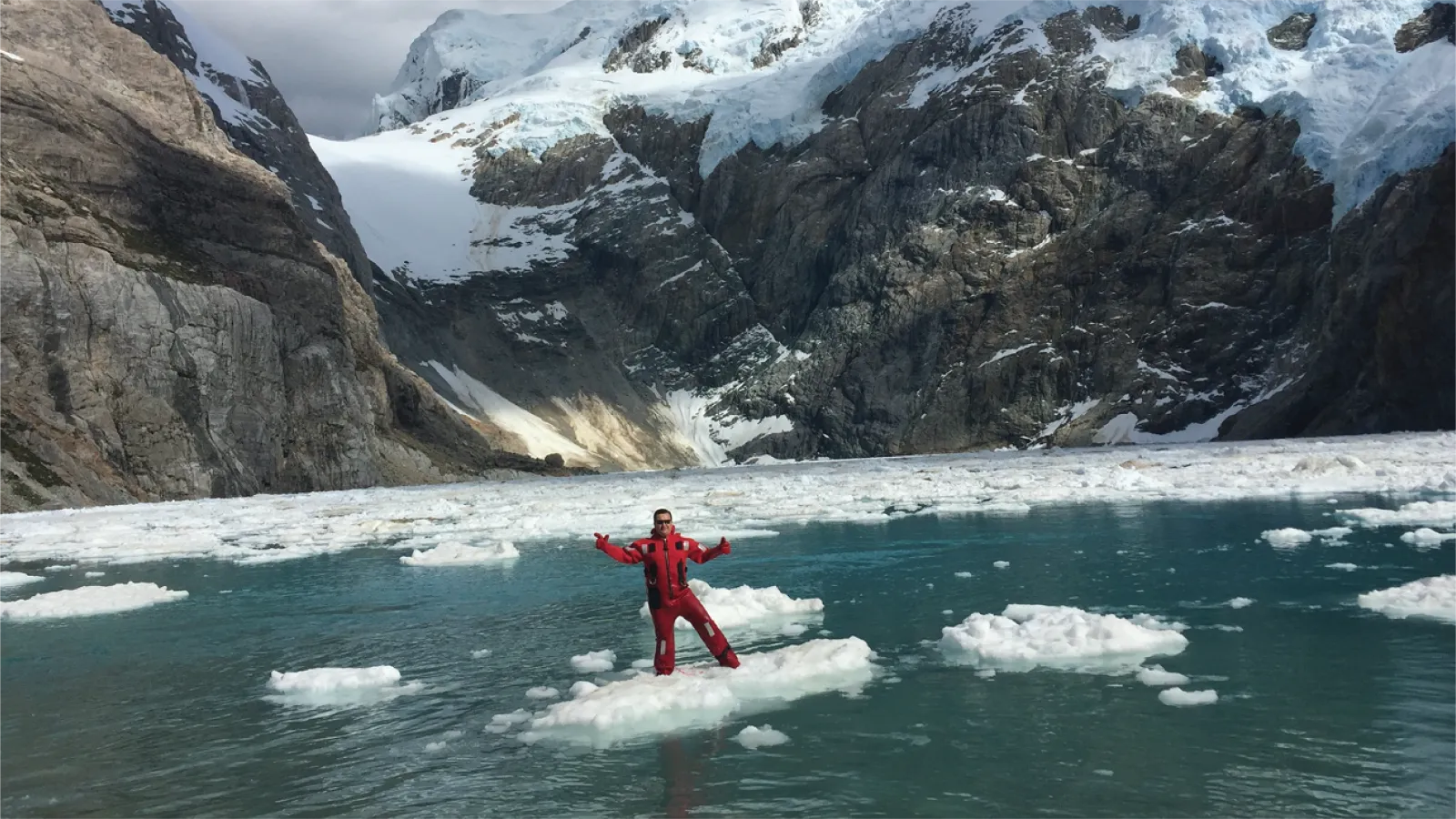 Julio stands on an iceberg