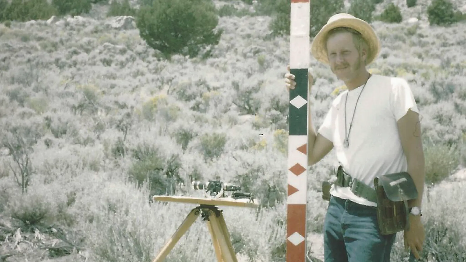 WIlliam Mahoney at Field Camp holding the "Spieker Stick"