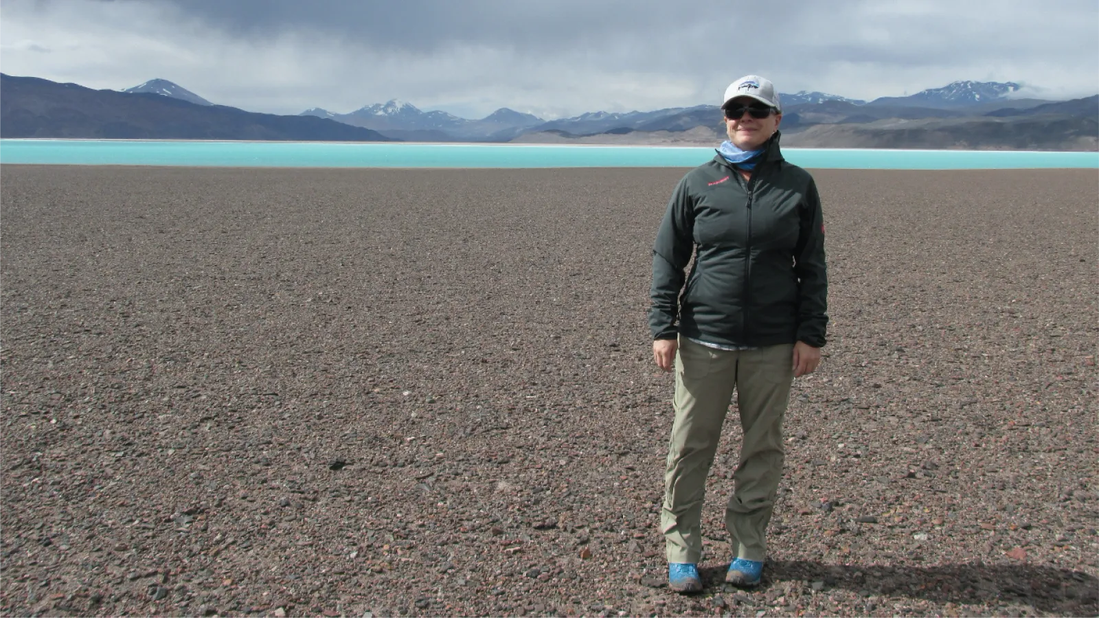 LeeAnn Munk in the field in front of mountains