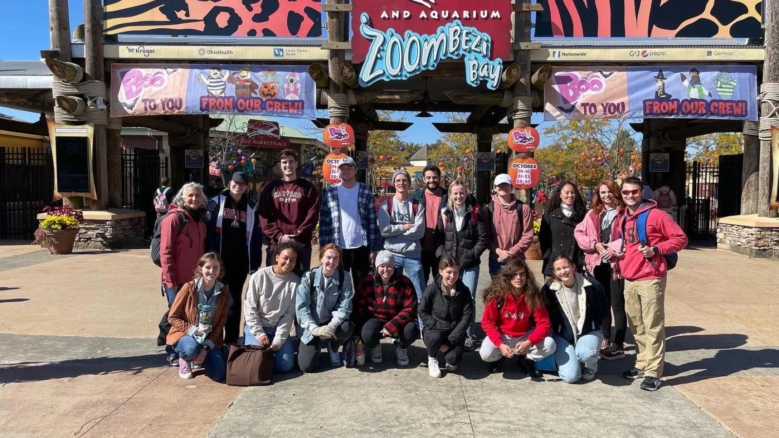 Group photo in front of the zoo sign