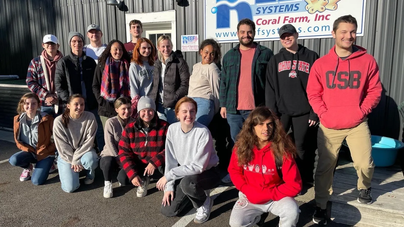 Group photo outside of the Reef Systems building