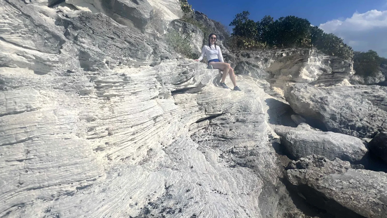 Aubree Steinmetz sits atop eolianites.