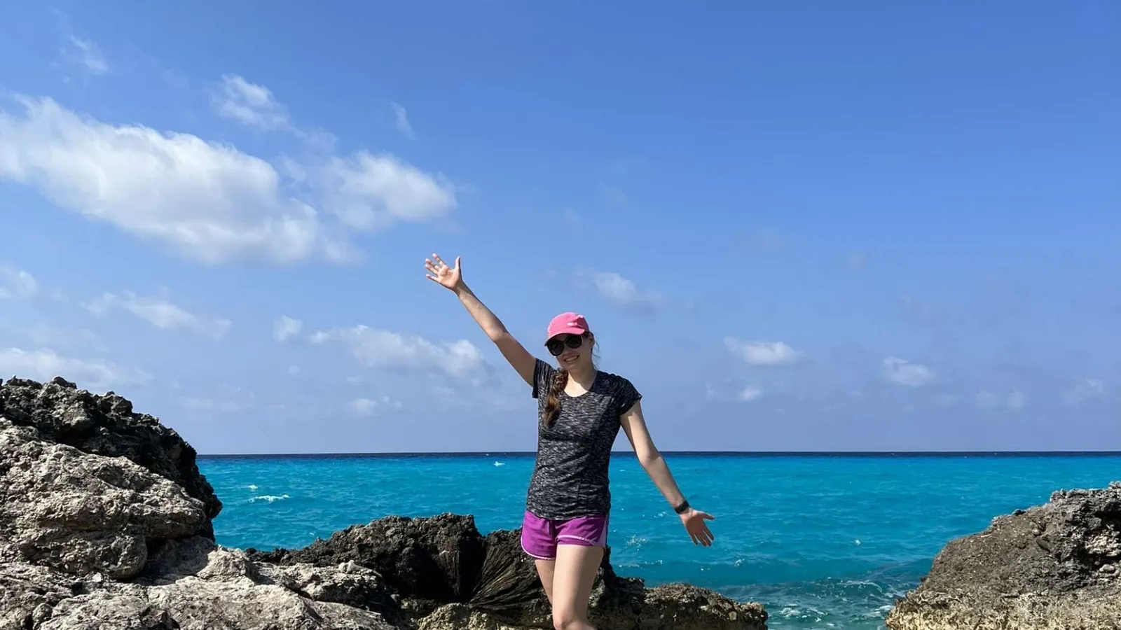 Undergraduate student Katherine Iler smiles and waves