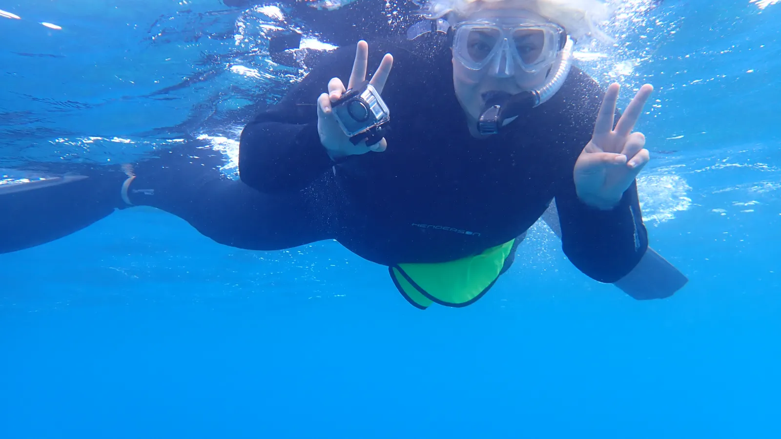 Megan O'Quin snorkeling and smiling.