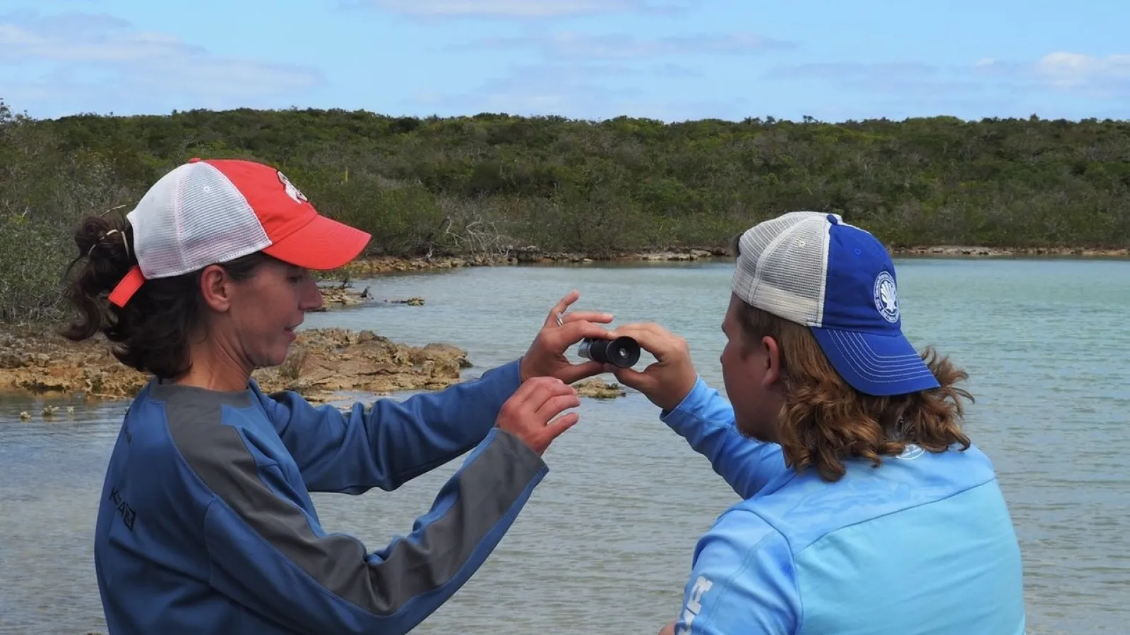 Professor Liz Griffith and Nolan Kachmar at a blue hole.