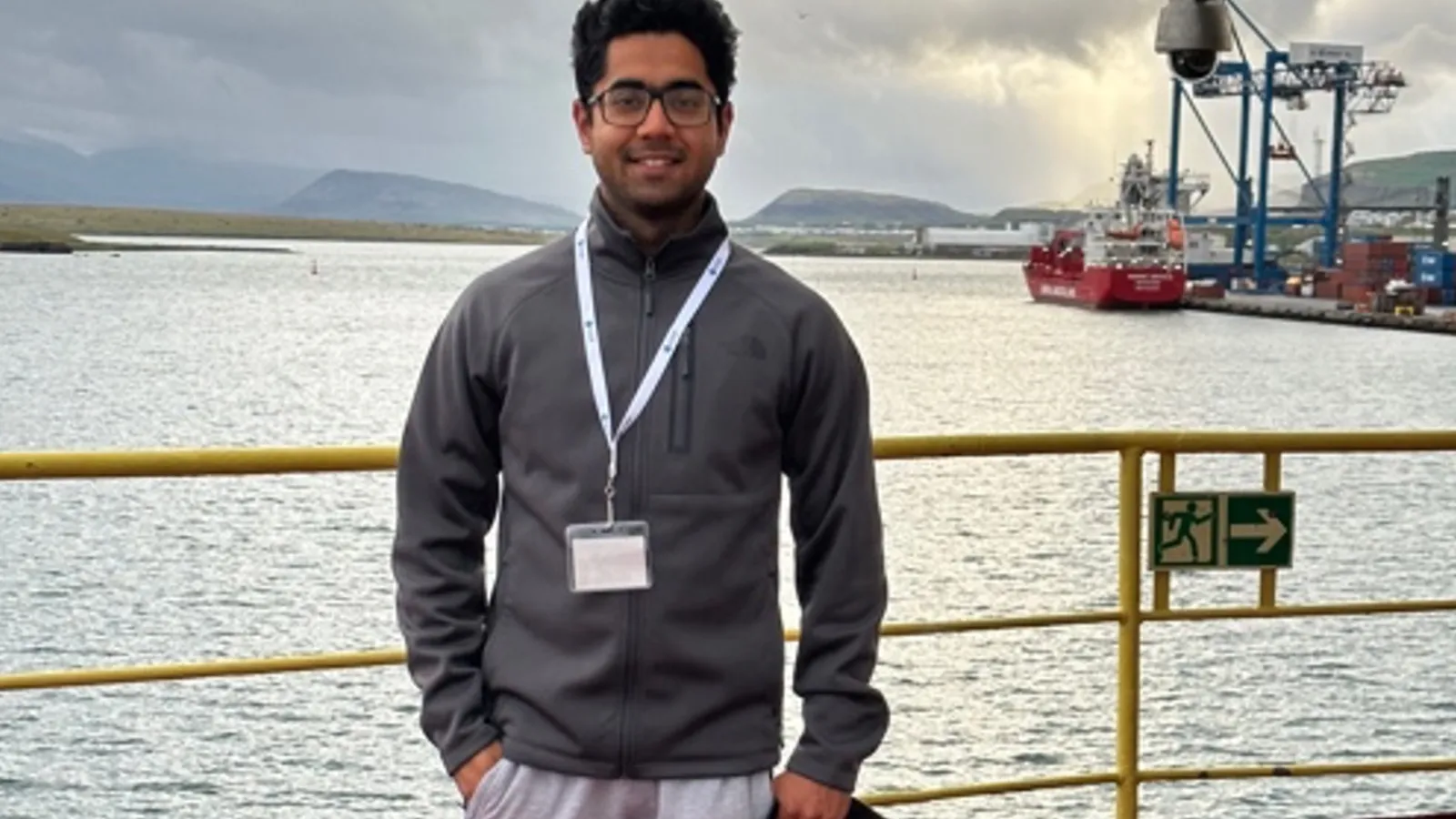 Graduate student Fawz Naim standing on a research vessel