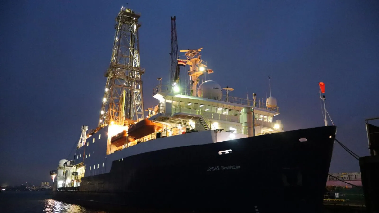 The JOIDES Resolution docked in the port of Amsterdam, Netherlands, at night. (Credit: Erika Tanaka &amp; IODP JRSO)