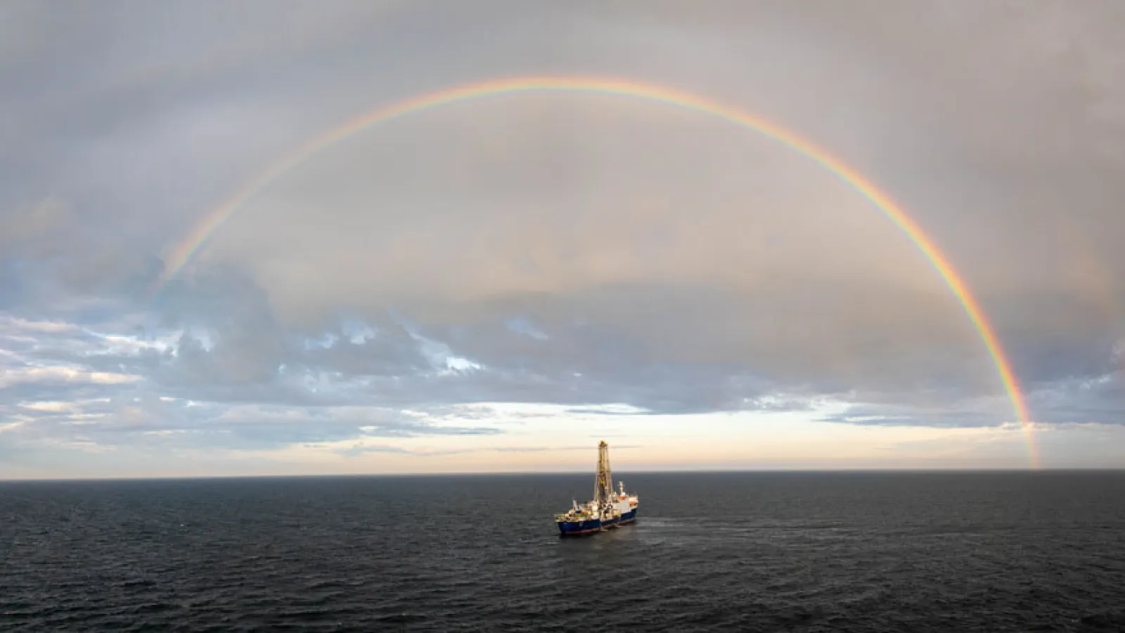 A drone captures a beautiful image of the JOIDES Resolution surrounded by a rainbow. Credit: Chris Lyons & IODP