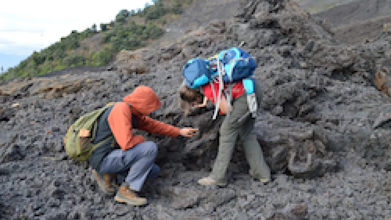 Earth Science students examining volcanic rock deposits