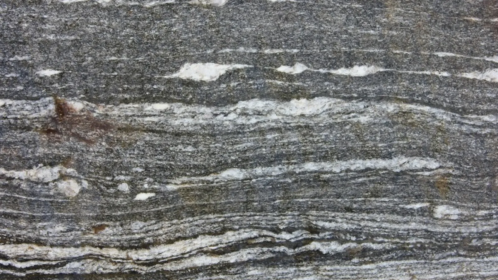 Professor Young took this photo in Norway of porphyroclasts of feldspar that were exposed to shear during continental collision.