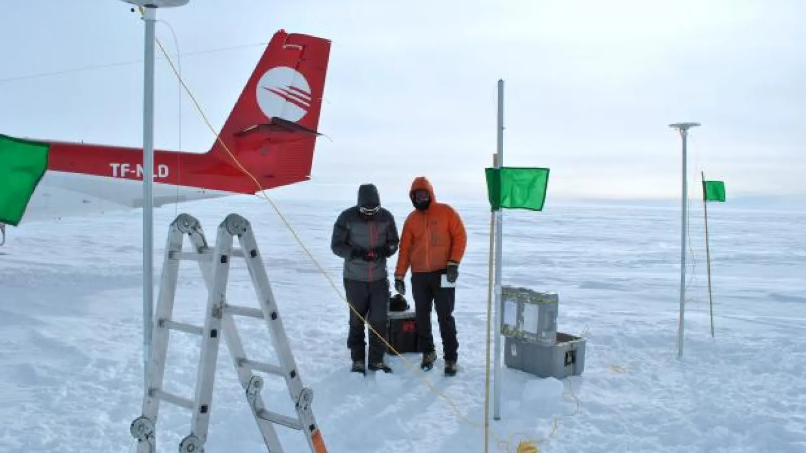 Photo of Professor Howat (right) and Santiago de la Peña (left) conducting fieldwork in Greenland, 2014.