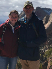 Michael Braunagel smiling with his fiancee while hiking