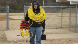 Jim Cox wearing field equipment