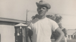 Black and white photo of Joe Wojcik wearing a cowboy hat at field camp