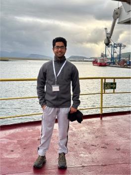 Fawz Naim standing on a research vessel