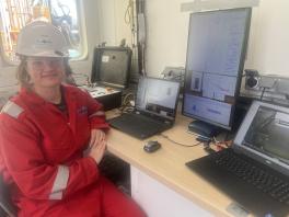 Professor Cook in the well logging shack as well logging data is collected offshore Martha's Vineyard.