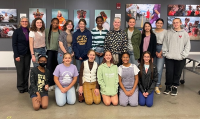 students from Columbus School for Girls sit and stand with Dr. Lindy Elkins-Tanton 