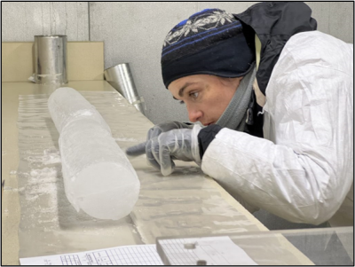 Emilie in the BPCRC cold room, observing the visual stratigraphy of the Huascarán ice core.