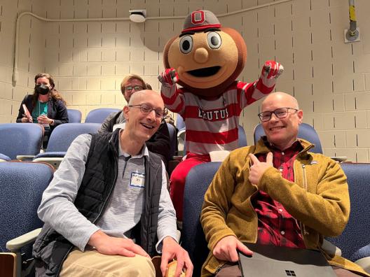 Professors Saltzman and Mark posing with Brutus