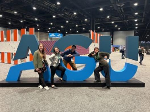 Photo of Professor Crowell and his research group at UW, taken at 2022 AGU Fall Meeting in Chicago.