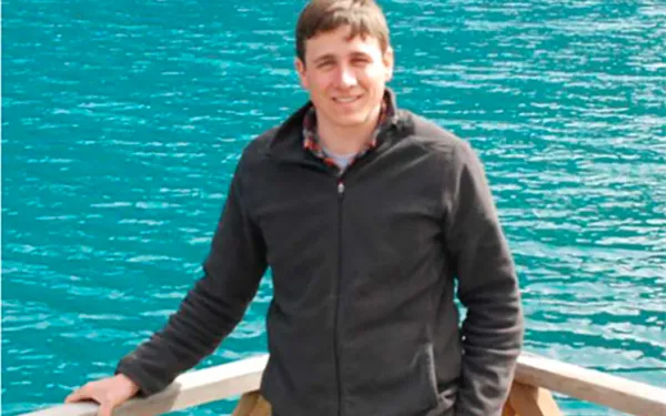 Jacob Heck leaning on a dock