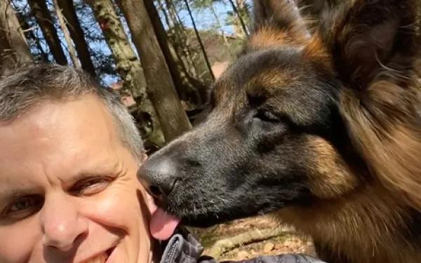 Lower with his dog