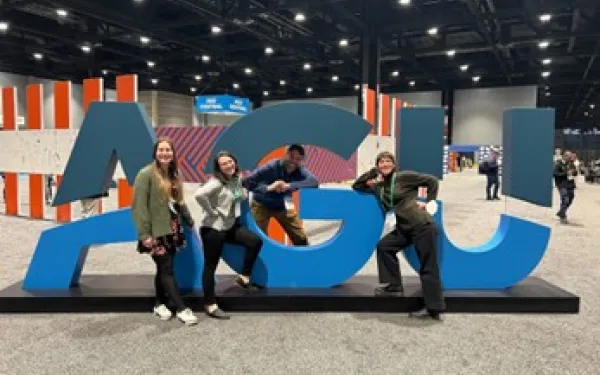 Photo of Professor Crowell and his research group at UW, taken at 2022 AGU Fall Meeting in Chicago.
