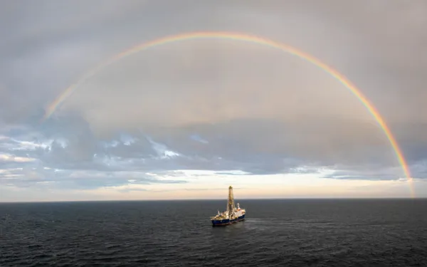 A drone captures a beautiful image of the JOIDES Resolution surrounded by a rainbow. Credit: Chris Lyons & IODP