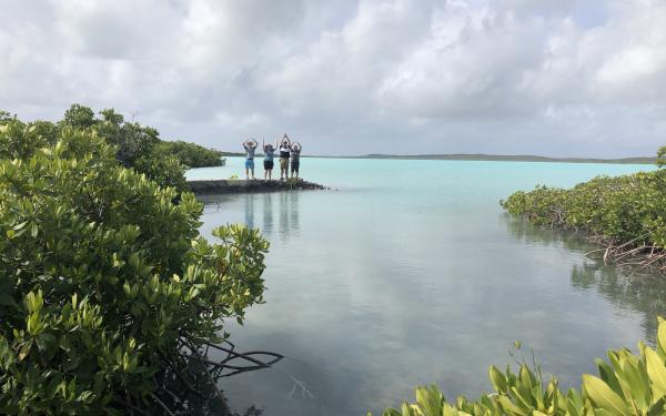 Overlooking a lagoon, students carry out the O-H-I-O 