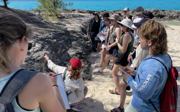 Students examine fossil reef.
