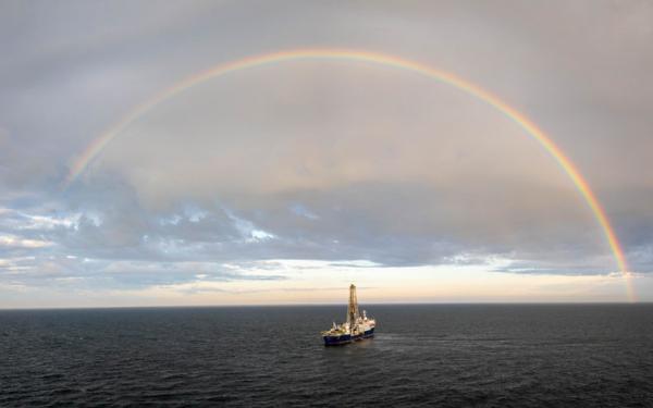 A drone captures a beautiful image of the JOIDES Resolution surrounded by a rainbow. Credit: Chris Lyons & IODP