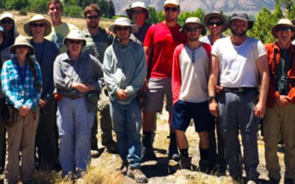 Geology majors and faculty gather behind Temple Hill during field camp.