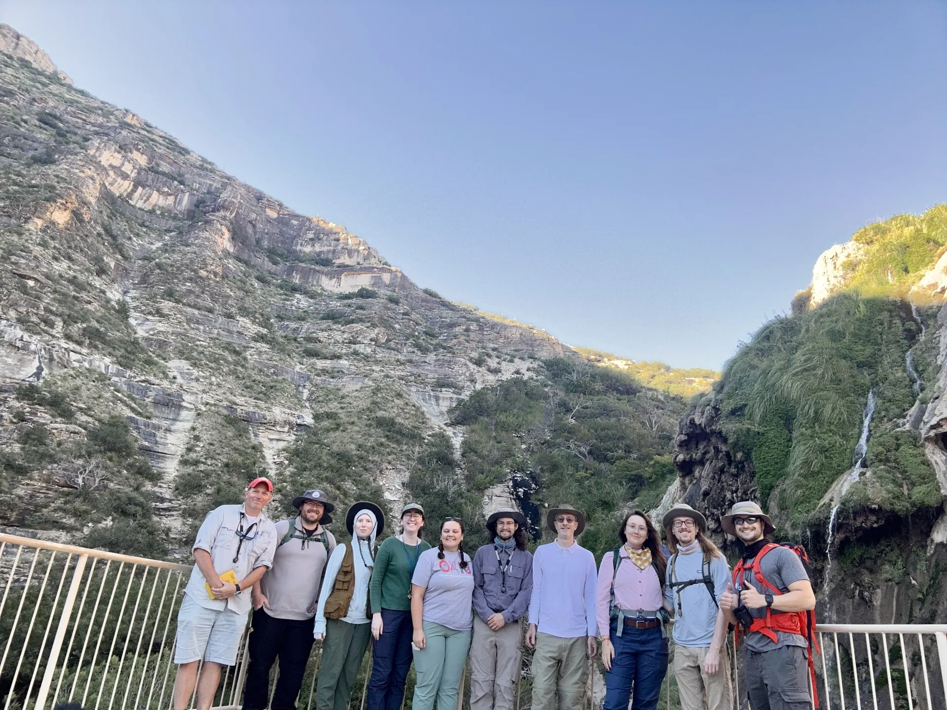 Group photo in front of Sitting Bull Falls near Last Chance Canyon.