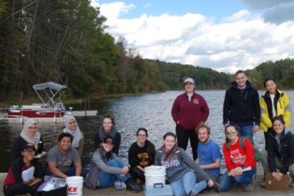 Geochemistry class poses at Lake Hope boat dock