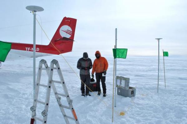 Photo of Professor Howat (right) and Santiago de la Peña (left) conducting fieldwork in Greenland, 2014.