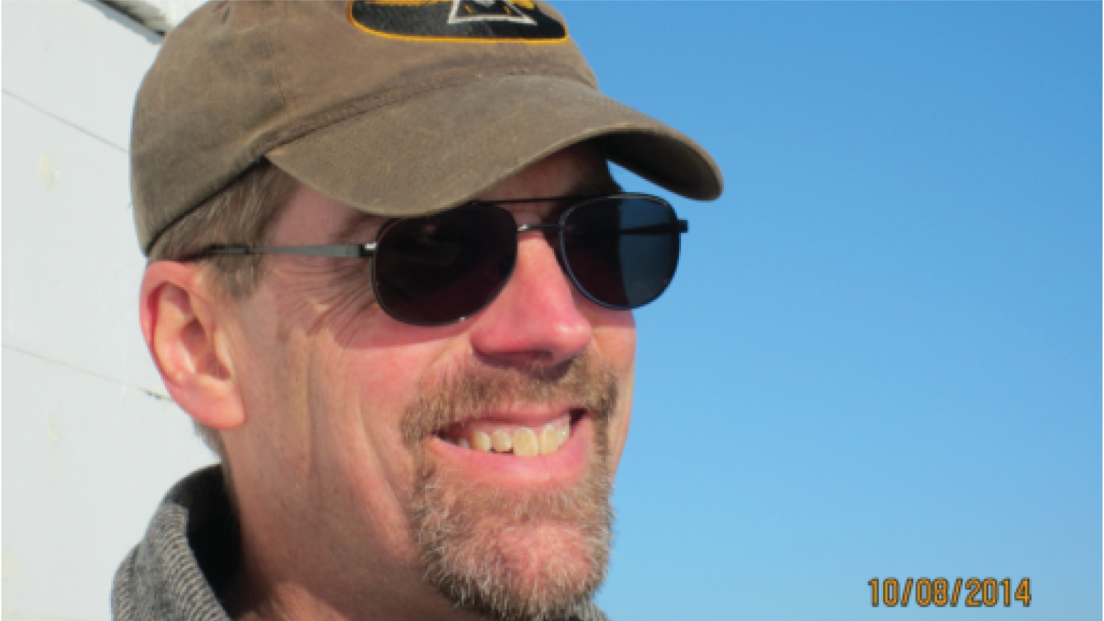 Jeff DeFreest wearing a hat and aviator sunglasses