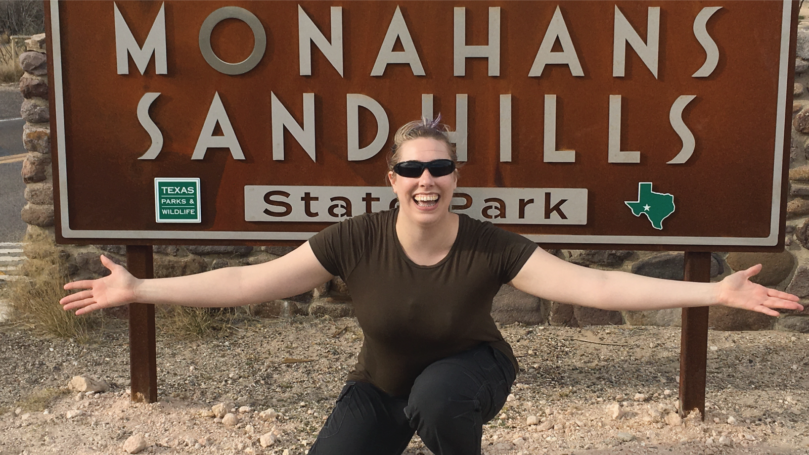 Meredith Faber smiling on a hike at Monahans Sandhills State Park