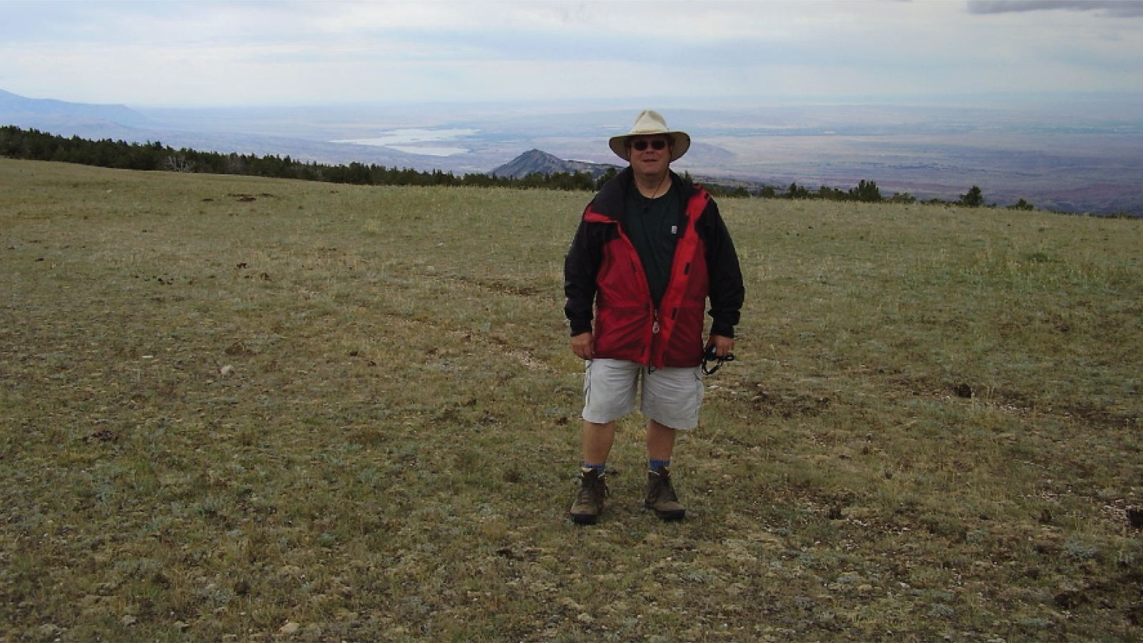 Mark Izold hiking in a field