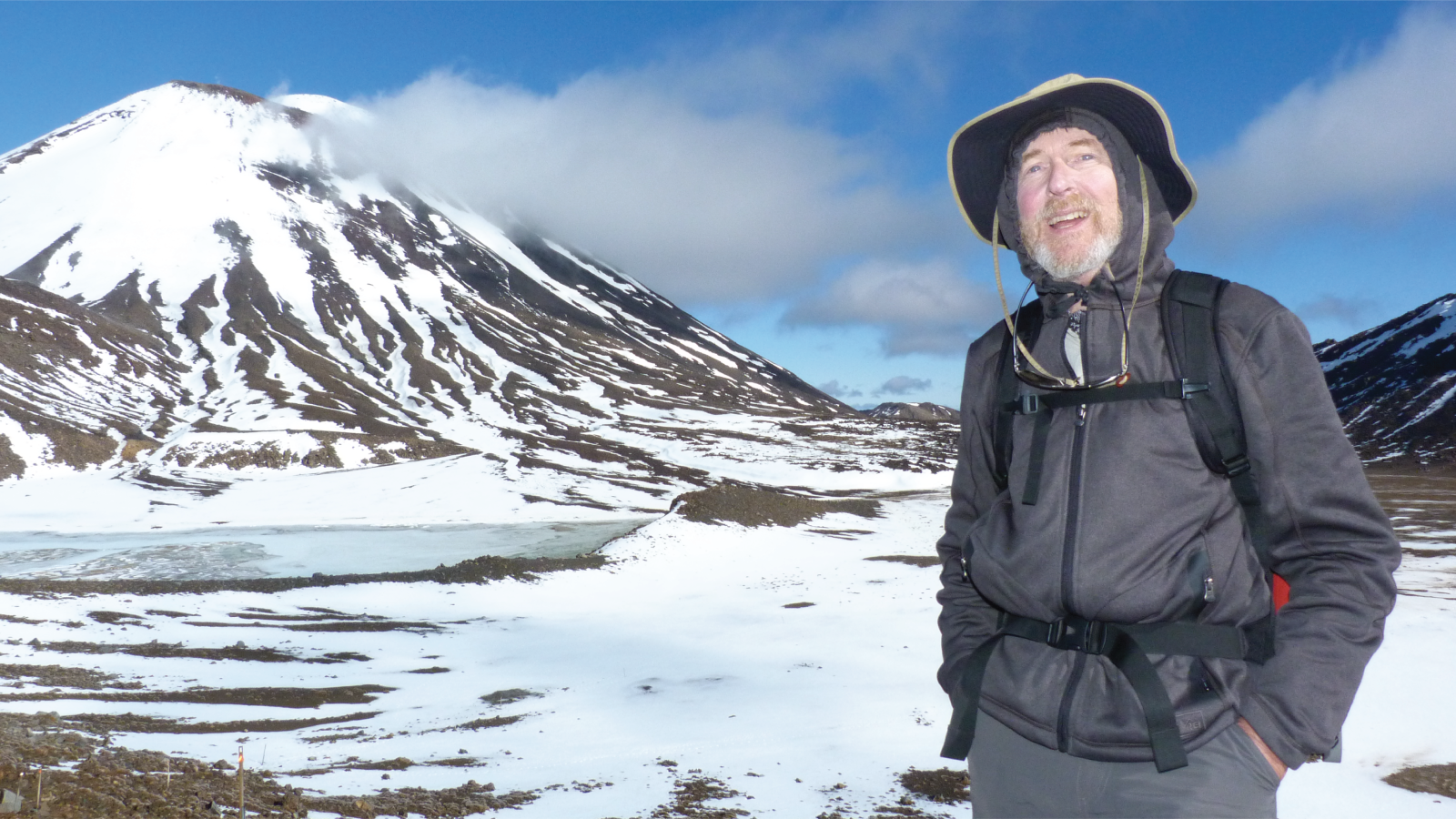 William Mahoney hiking near a snowy mountain