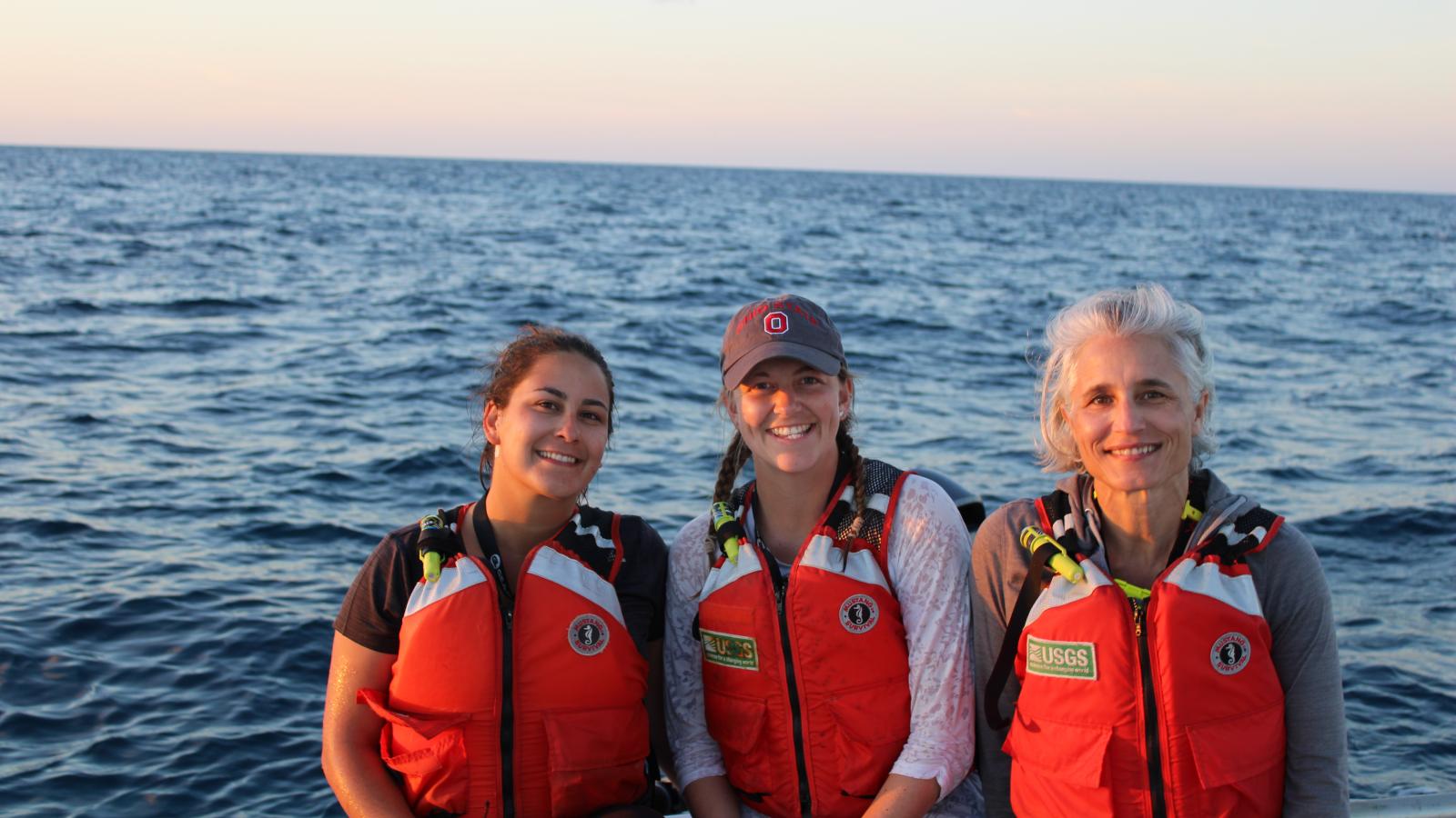 Dr Andrea Grottoli, graduate student Ann Marie Hulver, and postdoc Dr. Leila Chapron on the boat before sampling (R to L)