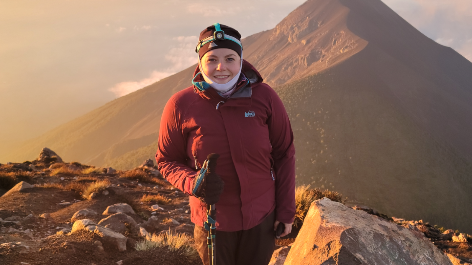 Lindsey at sunrise in front of Fuego Volcano