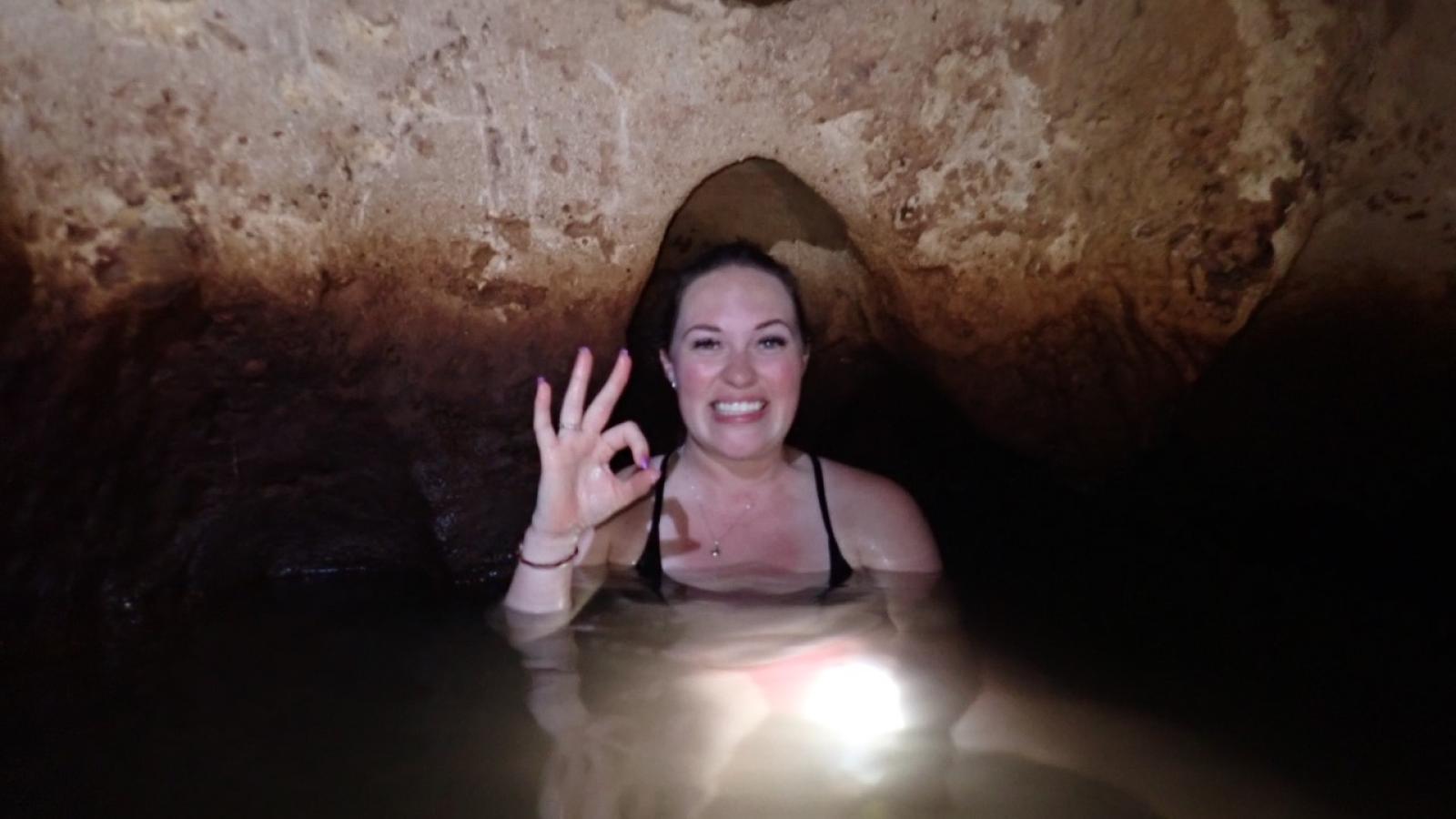 Miranda Manross swims in a cave.