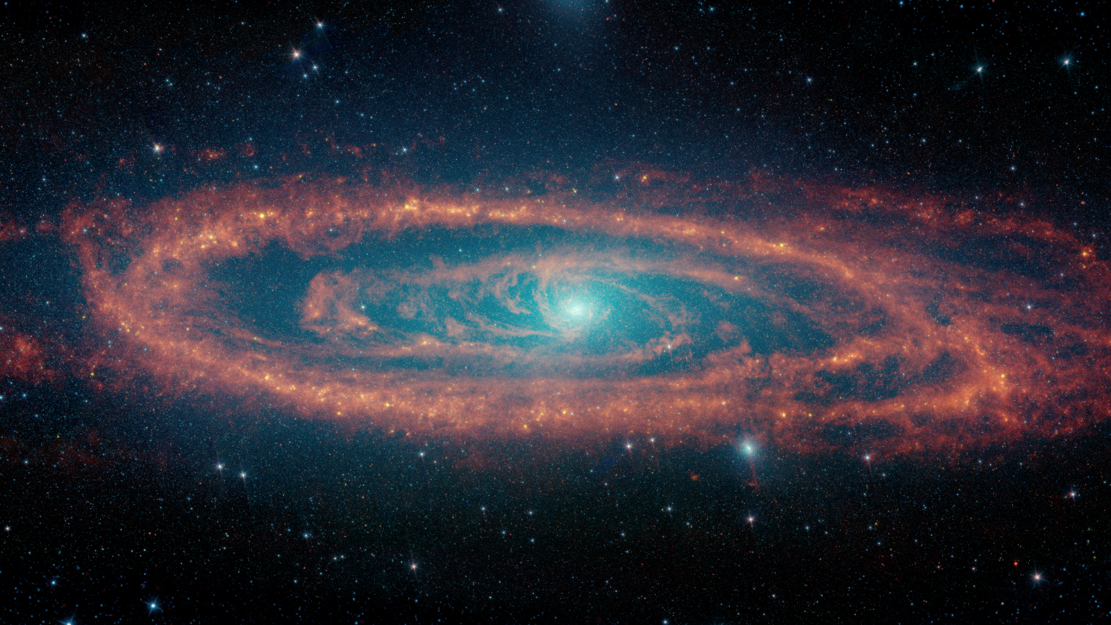 The Andromeda galaxy's stars and dust clouds pictured by NASA's retired Spitzer Space Telescope.